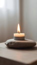 Single White Candle on Gray Stone Royalty Free Stock Photo