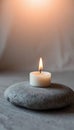 Single White Candle on Gray Stone Royalty Free Stock Photo