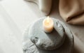 Single White Candle on Gray Stone Royalty Free Stock Photo