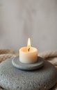 Single White Candle on Gray Stone Royalty Free Stock Photo