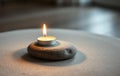 Single White Candle on Gray Stone Royalty Free Stock Photo