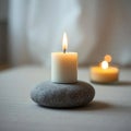 Single White Candle on Gray Stone Royalty Free Stock Photo