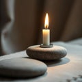 Single White Candle on Gray Stone Royalty Free Stock Photo