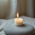 Single White Candle on Gray Stone Royalty Free Stock Photo