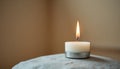 Single White Candle on Gray Stone Royalty Free Stock Photo