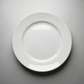 Single white ceramic plate on gray background Royalty Free Stock Photo