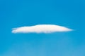 Single white cloud on clear blue sky background Royalty Free Stock Photo