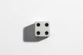 Single white dice with a four on a white background. Win or lose. Catch your luck. Gambling equipment Royalty Free Stock Photo