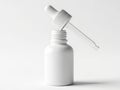 Single white dropper bottle with liquid Royalty Free Stock Photo