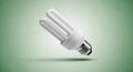 Single Energy Saving Compact Fluorescent Light Bulb Floating on a Green Gradient Background Royalty Free Stock Photo