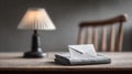 A single white envelope rests on a folded grey cloth atop a rustic wooden table, illuminated by a soft lamp in the background Royalty Free Stock Photo