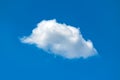 Single white fluffy cloud in the blue sky Royalty Free Stock Photo