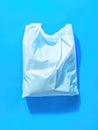 White plastic bag on blue surface Royalty Free Stock Photo
