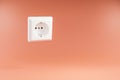 single white power socket floating in the air over infinite orange colored background 3D Illustration