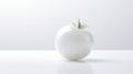 A single white tomato is shown in close-up, revealing its glossy skin. Royalty Free Stock Photo