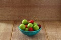 Single whole fresh green Can Erik plum and cherry close up isolated on dark background. Royalty Free Stock Photo