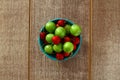 Single whole fresh green Can Erik plum and cherry close up isolated on dark background Royalty Free Stock Photo