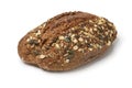 Single whole sourdough loaf of bread with a variation of seeds close up on white background