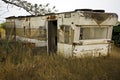 Single wide retro trailer house rusty trash trashy mobile home Royalty Free Stock Photo