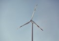Single wind turbine against the blue sky at sunset Royalty Free Stock Photo