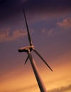 SINGLE WIND TURBINE AGAINST SKY AT SUNSET Royalty Free Stock Photo