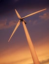 SINGLE WIND TURBINE AGAINST SKY AT SUNSET Royalty Free Stock Photo