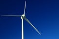 Single wind turbine on dark blue sky Royalty Free Stock Photo