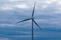 Single wind turbine on dark cloudy sky Royalty Free Stock Photo