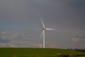 A single wind turbine generating power in a field in rural Cambridgeshire Royalty Free Stock Photo