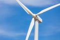 Single White Wind Turbine Over Dramatic Blue Sky Royalty Free Stock Photo