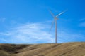 Single wind turbine on top of a hill Royalty Free Stock Photo
