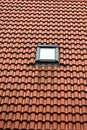 Single window on red roof Royalty Free Stock Photo