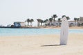 Single windsurfing board in a sand