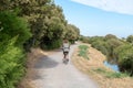Single woman ride bike in path bikeway in Ile de noirmoutier France VendÃÂ©e