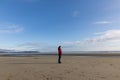 single women stand and enjoy a magnificent beach at vancouver island Royalty Free Stock Photo
