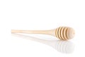 Single wooden for honey spoon on white background, honey stick isolated, Wooden spoon for honey. Close-up Royalty Free Stock Photo