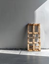 Single Wooden Pallet Against a Gray Wall with Sunlight Royalty Free Stock Photo