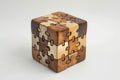 A single wooden puzzle piece rests on top of a table, showcasing a part of a larger puzzle waiting to be solved, Three dimensional Royalty Free Stock Photo