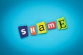 Single word - shame. Text on blue background from colored letters. Message on poster. Headline on card. Multicolored inscription o