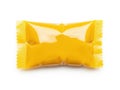 Single yellow candy wrapper isolated on white background Royalty Free Stock Photo