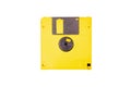 Single yellow floppy drive, old vintage diskette, asset isolated on white background, top view. Save icon concept, obsolete tech