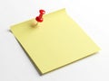 Single yellow post-it note with red pushpin Royalty Free Stock Photo