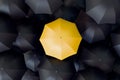 Single Yellow Umbrella Among Black Royalty Free Stock Photo