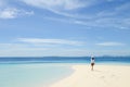 beautiful young girl walking on tropical beach Royalty Free Stock Photo