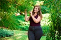Single Young Pretty Plus Size Caucasian Happy Smiling Laughing Girl Woman, Walking In Summer Green Forest. Fun Enjoy Royalty Free Stock Photo