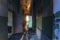 Sinister and creepy Corridor of abandoned hospital after fire. Ceiling in black soot