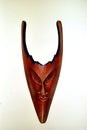 Sinister wooden mask with horns