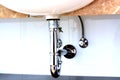 Sink drain pipe in a bathroom Royalty Free Stock Photo