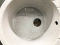 Sink without faucet and drainage pipes. concrete sink with holes for water supply and drainage. sink for home, goods in a hardware