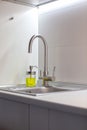 Sink Reflections in the kitchen in white color.